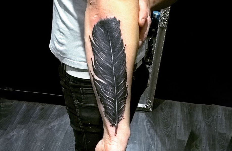 Crow feather tattoo on your arm