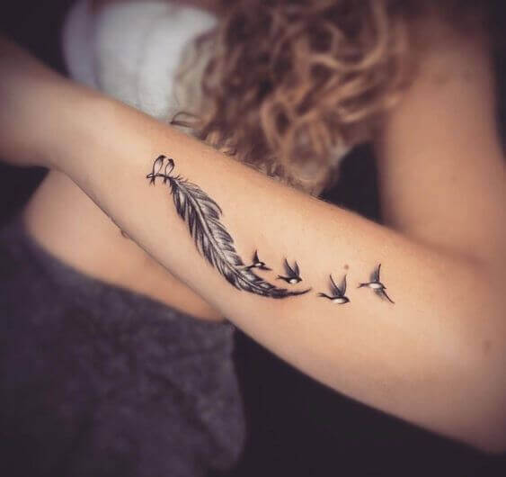 Feather tattoo on arm