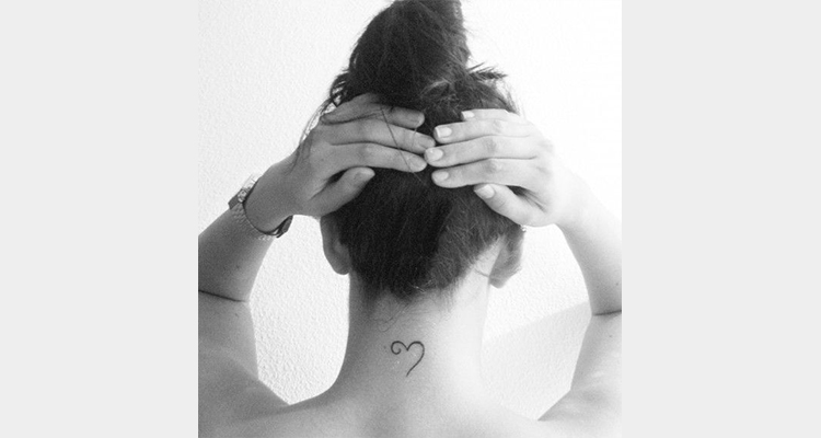 Half a Heart tattoo on nape