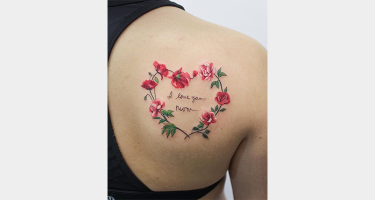 Heart tattoo with roses on back