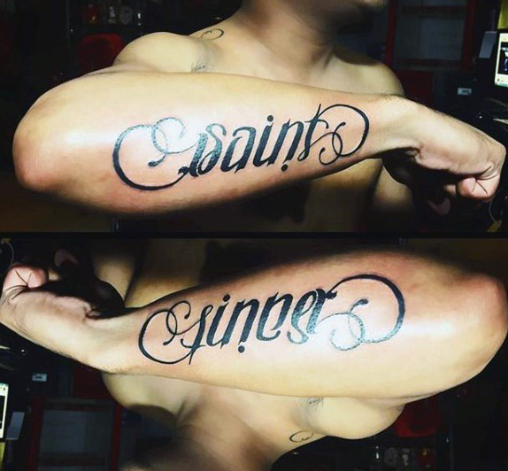 Mens saint sinner ambigram tattoos on outer forearm