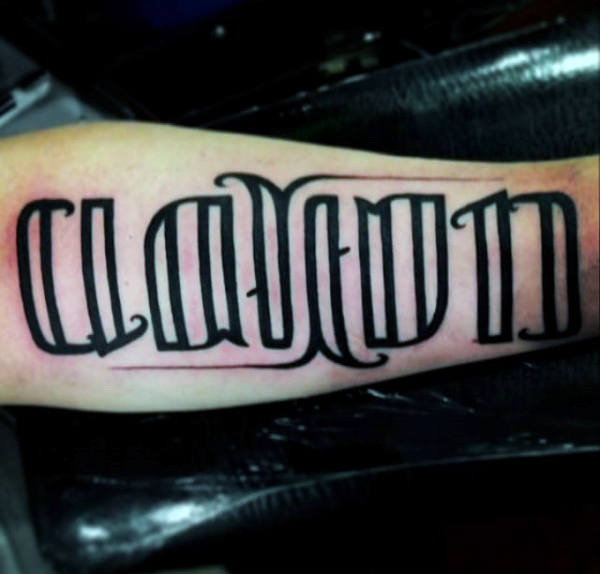 Outline black ink mens ambigram tattoos with black ink on arm
