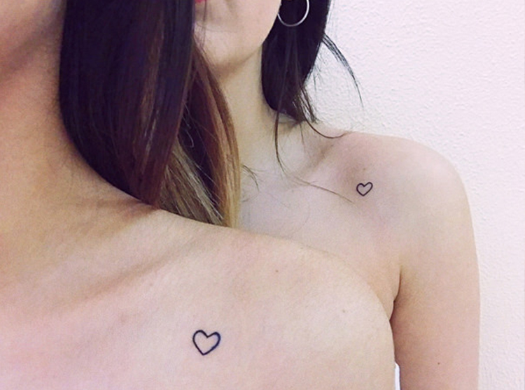 Simple Heart tattoo on girl's shoulder