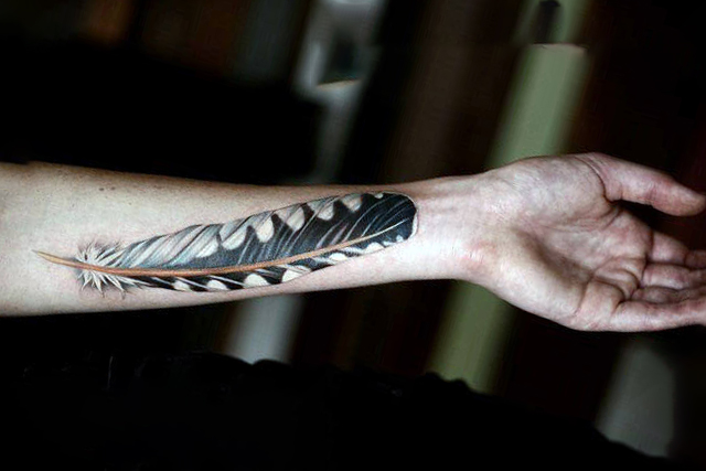 Turkey feather tattoo on your forearm