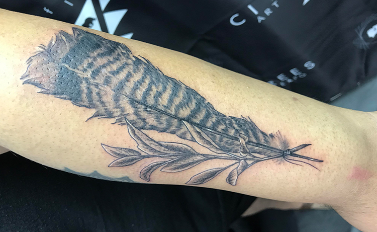 Turkey feather tattoo