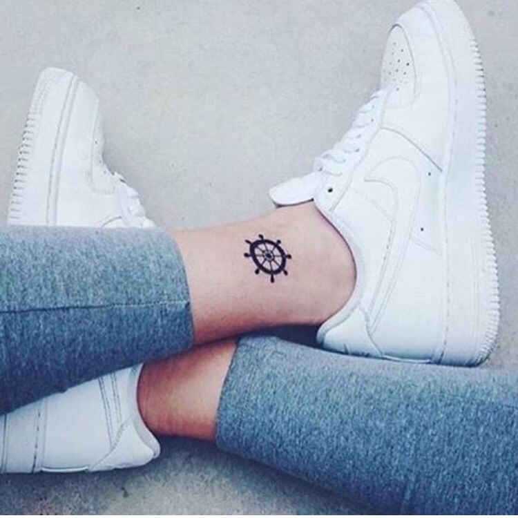 Wheel tattoo on ankle