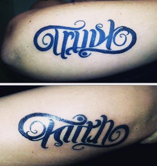guys-trust-Faith ambigram tattoos on outer forearm