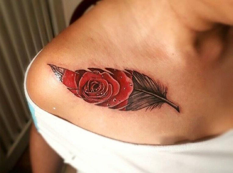 rose with a feather Tattoo
