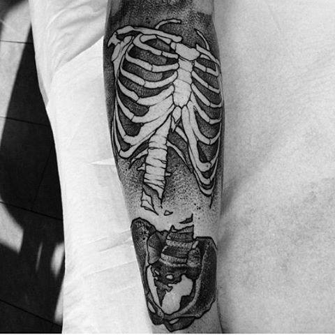 Amaizng broken spine forearm tattoo on man