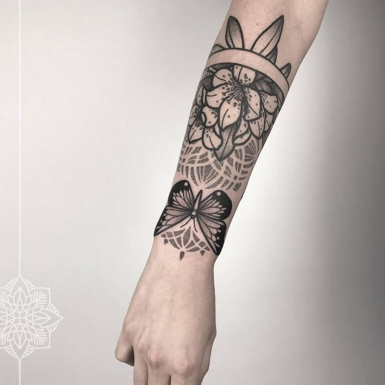 Floral armband tattoo on the right forearm