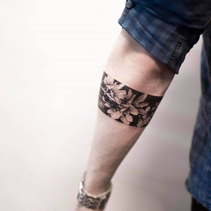 Floral leg band tattoo