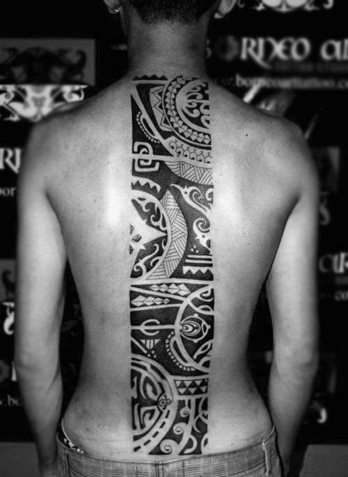Cool tribal centered spine guys tattoos