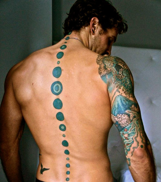 Gentleman with blue dot spine tattoo