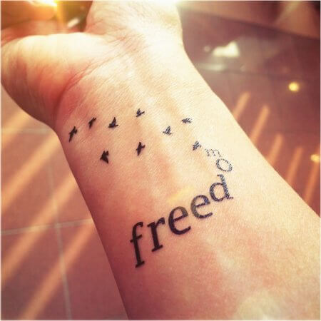 Small “FREEDOM” With Birds Tattoo Design