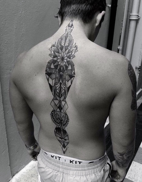 Traditional geometric spine male tattoo