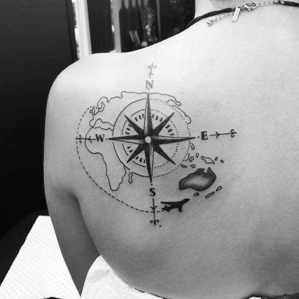 Compass with airplane ink