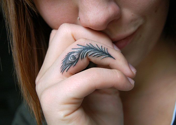 peacock feather finger tattoos for men and women