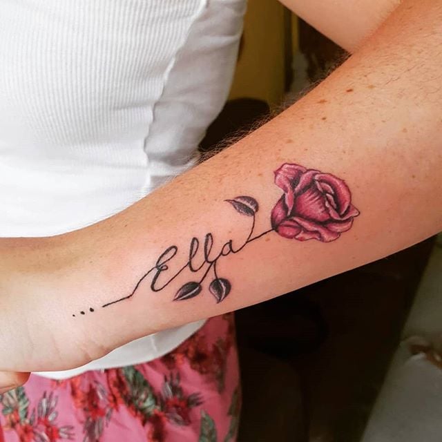 Name tattoo on a rose stem