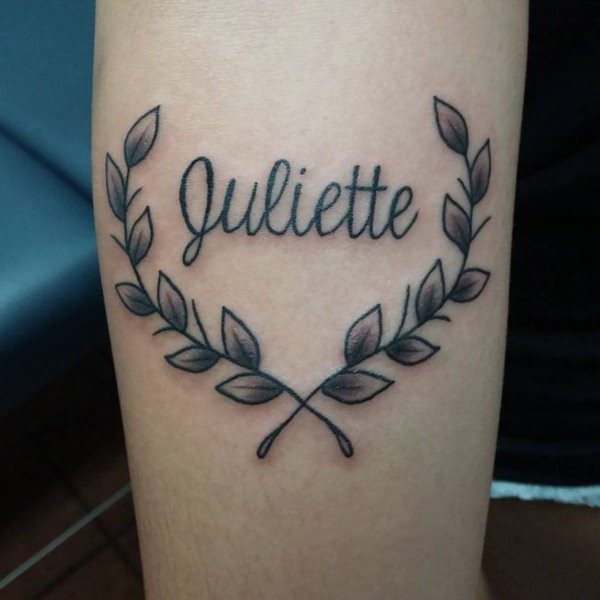Name tattoo with leaves 