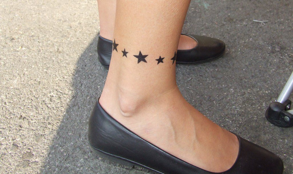 Small Black Star Tattoo on leg
