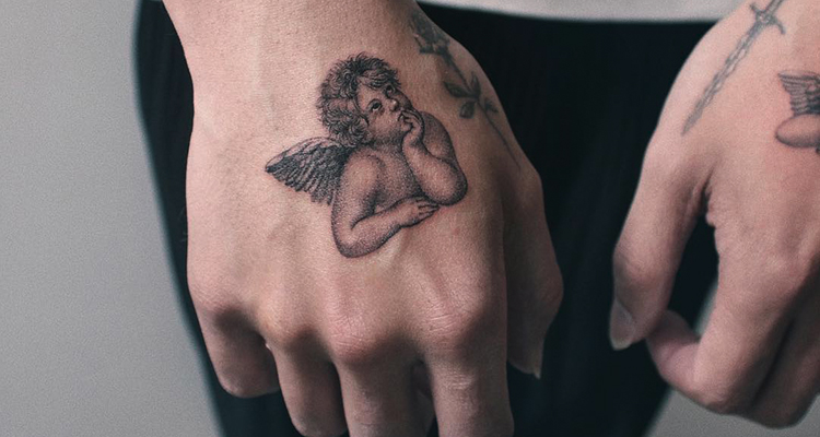 angel on your hand tattoo