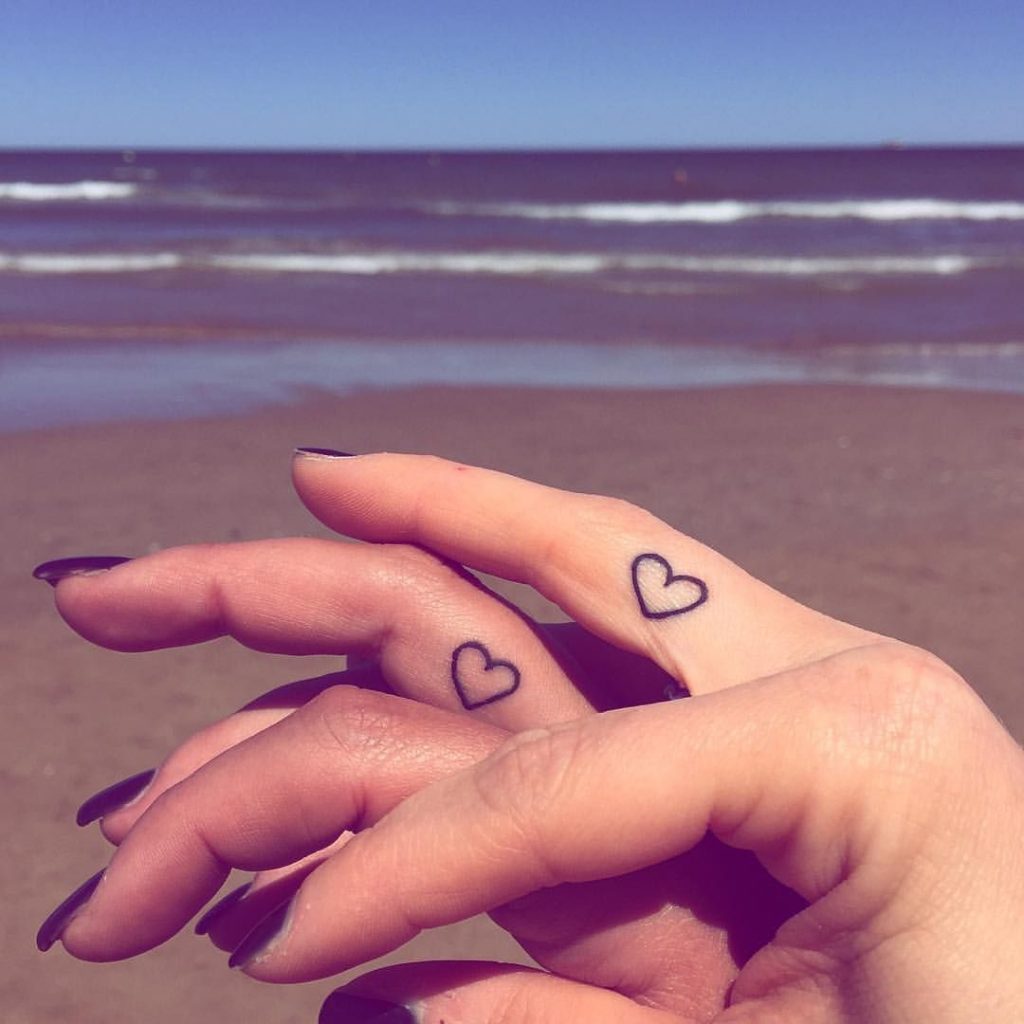 Small heart finger tattoos 
