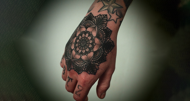 intricate mandala on your hand tattoo