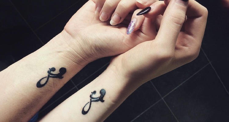 mother daughter symbol hand tattoo