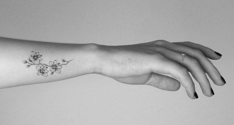 orchid flower on your hand tattoo