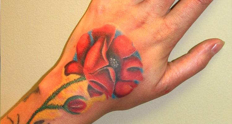 poppy flower on your hand tattoo