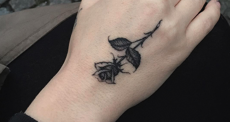 Black rose tattoo Designs on hand 