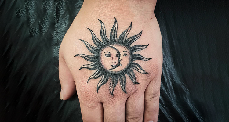 sun on your hand tattoo