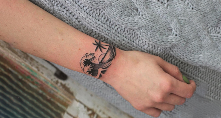 tropical sunset idea on hand tattoo