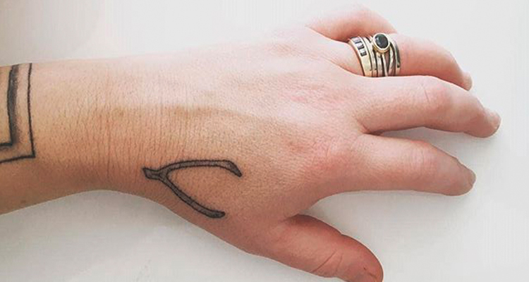 wishbone on your hand tattoo