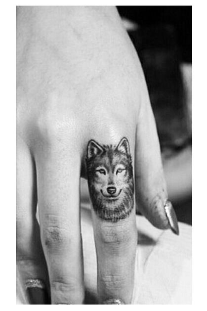 Wolf finger tattoos