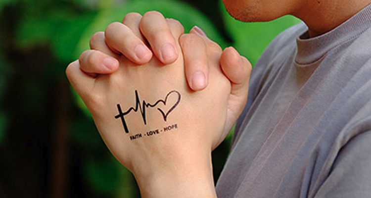 ‘FAITH HOPE LOVE’ on your hand tattoo