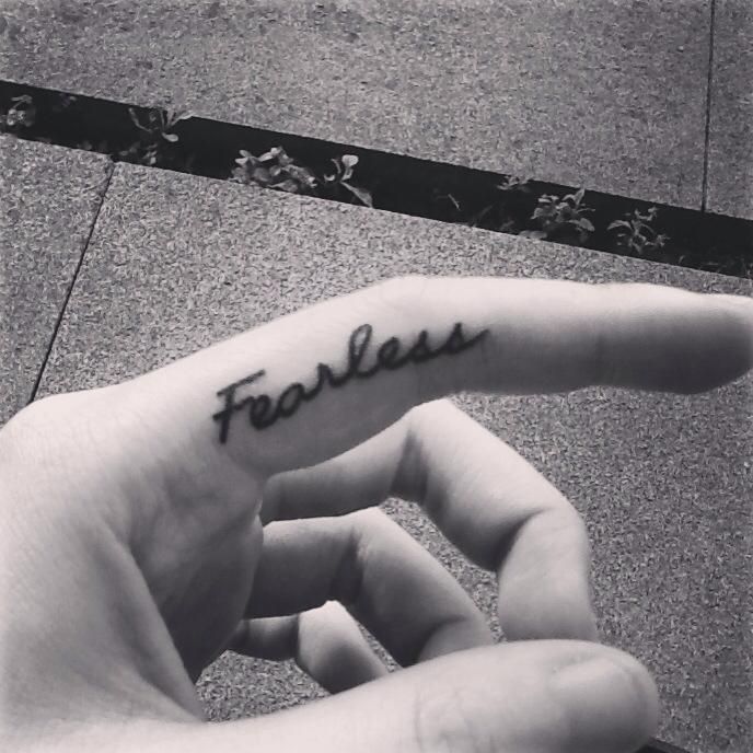 ‘FEARLESS’ finger tattoos