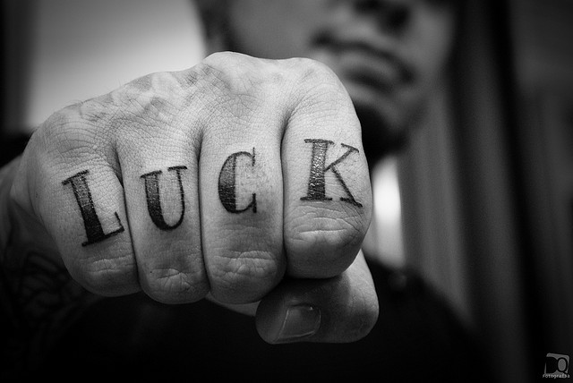 ‘LUCK’ finger tattoo