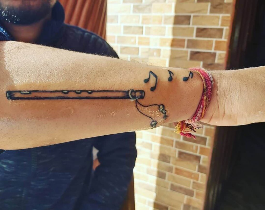 Flute Tattoo on Hand