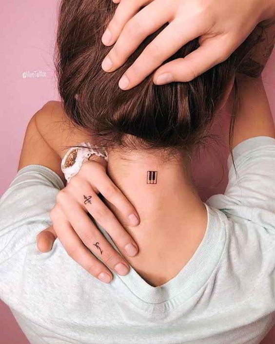 Symbole tattoo on neck