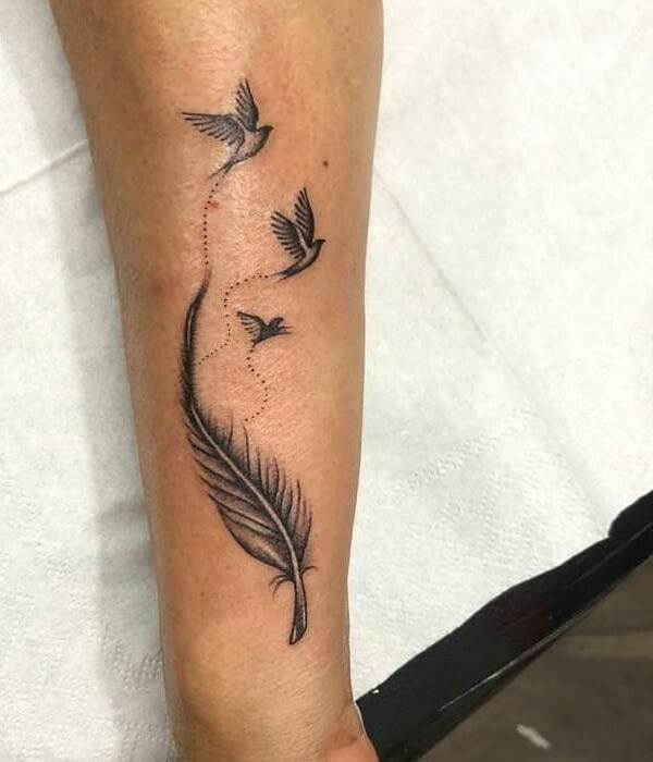 A Feather With Birds Hand Tattoo design