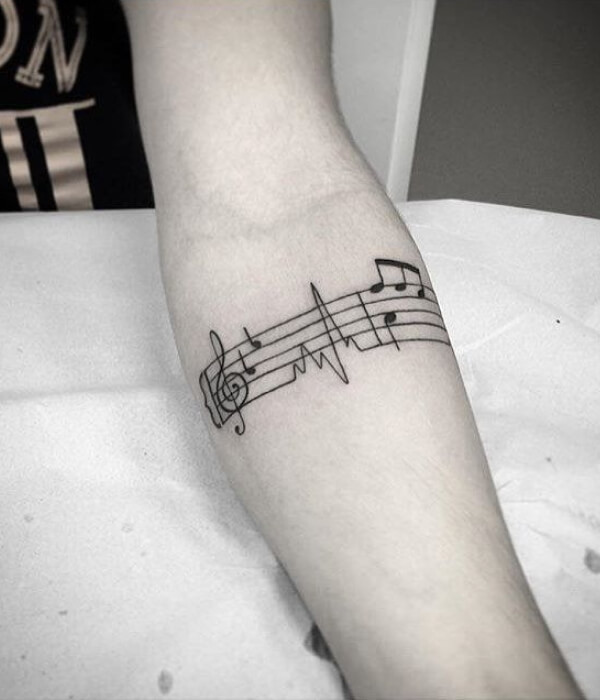 A Music Notes Hand Tattoo design