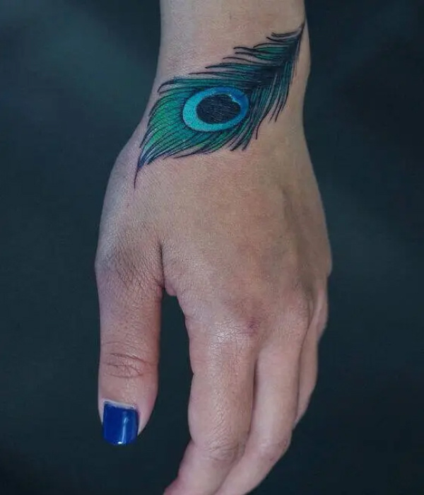 A Peacock Feather Hand Tattoo ideas - Simple Hand Tattoo Ideas For Girls