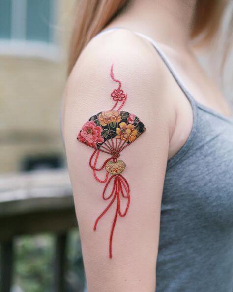 Flower tattoo on shoulder