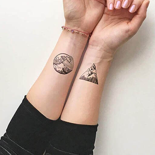 Mountain and Waves matching Tattoo on hand