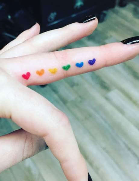 Tiny Colorful finger tattoos