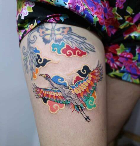 colorful tattoo girl on thigh