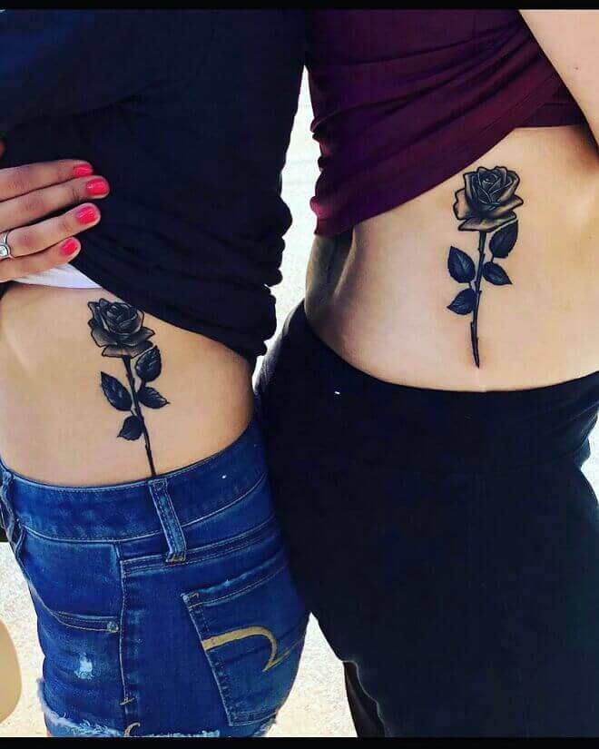 Black rose tattoo on Ribs