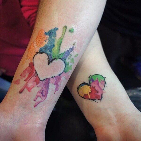 Colorful tattoo designs on hand