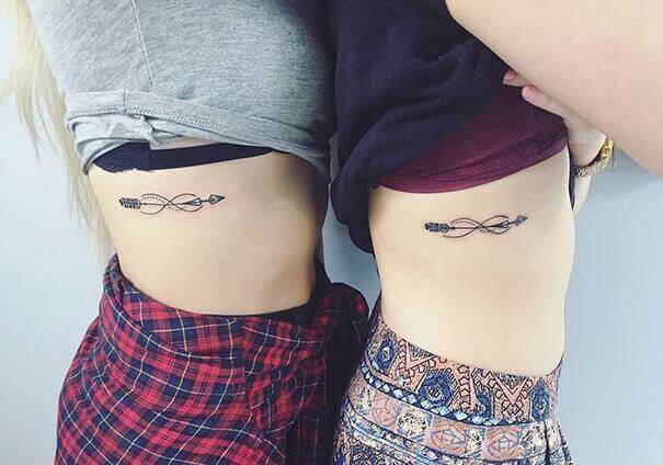 Arrow tattoo on ribs